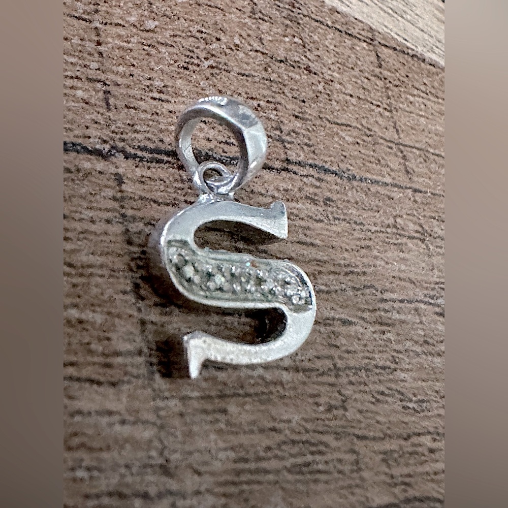 Silver Charm Letter “S” with CZ gems in the center.